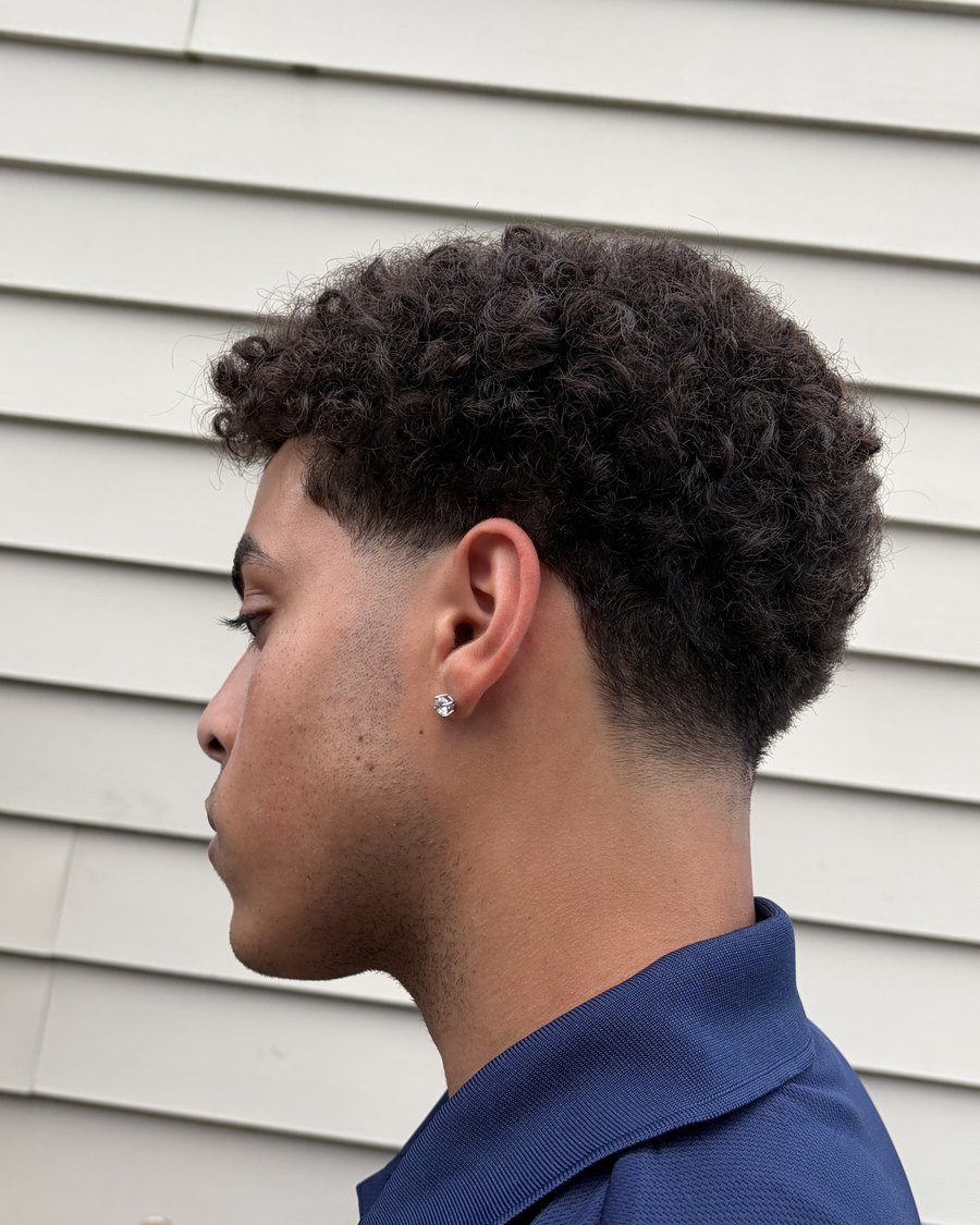 Curly top with a low taper